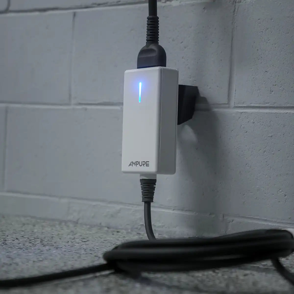 White power adapter with blue light on a tiled wall