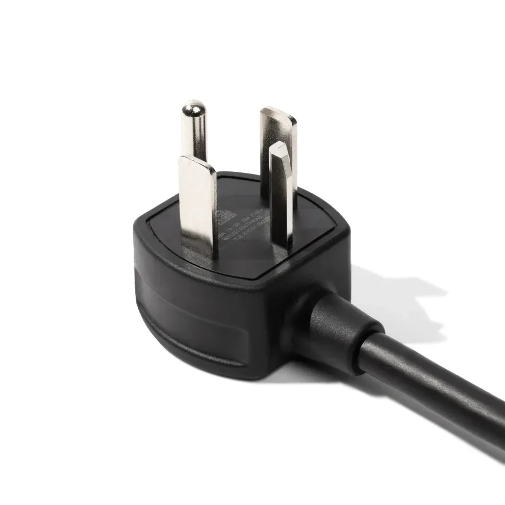Black power cord with plug on a white background