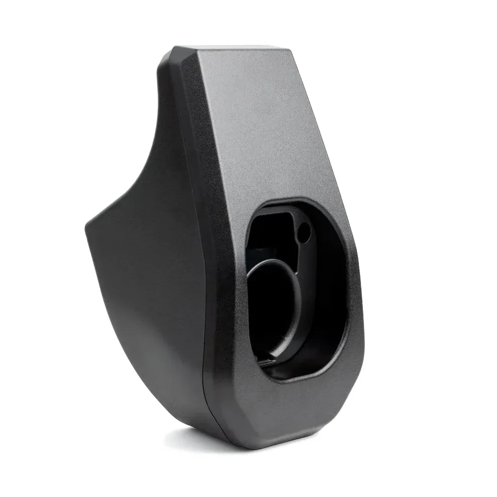 Black plastic component on a white background